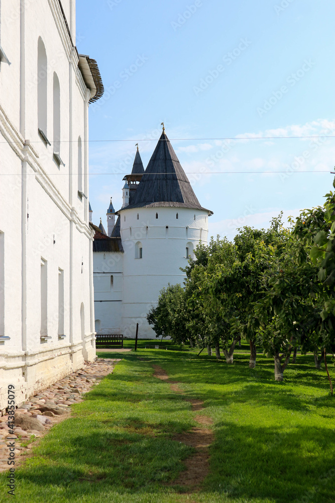 Summer view of medieval wall and towers of famous landmark of russian golden ring Rostov the great kremlin Summer view of medieval wall and towers of famous landmark of russian golden ring Rostov the great kremlin
