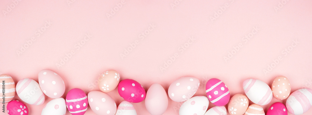Pink and white Easter Egg bottom border over a pink paper banner background. Copy space. Pink and white Easter Egg bottom border over a pink paper banner background. Copy space.