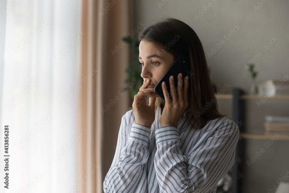 Sad millennial woman has difficult phone talk hold gadget by ear listen to unexpected bad news think on answer. Compassionate young lady support friend by cell try to help ponder on advice. Copy space Sad millennial woman has difficult phone talk hold gadget by ear listen to unexpected bad news think on answer. Compassionate young lady support friend by cell try to help ponder on advice. Copy space