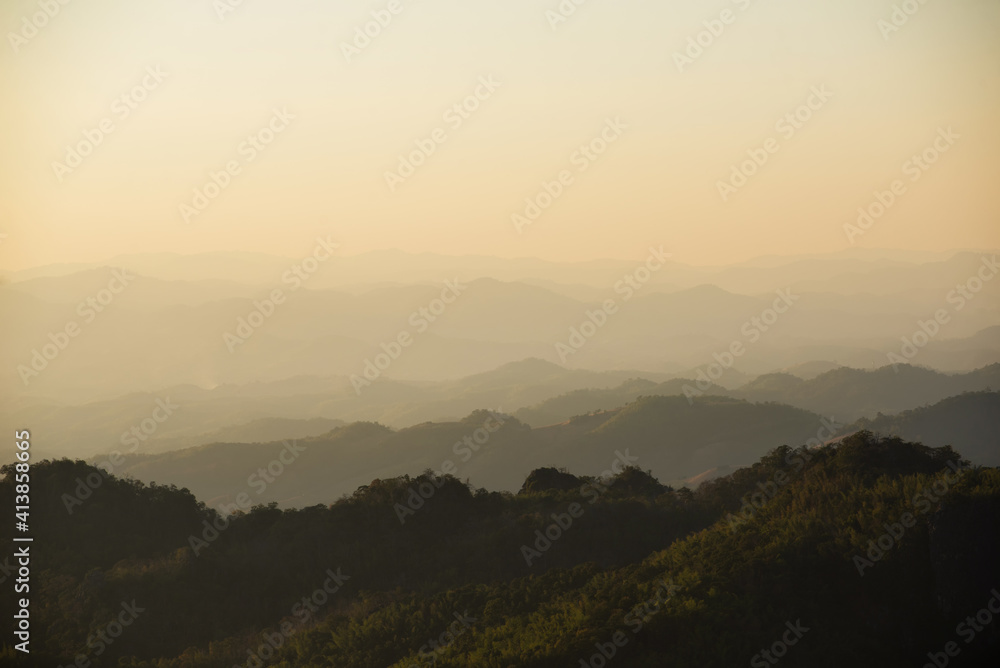 landscape in thailand sunrise on mountains peaceful with mist and sunlight at morning picturesque scenery outdoors travel.