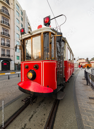 Nostalgic red tram in Taksim Square. Istiklal Street is a popular touristic destination in Istanbul, Turkey. .