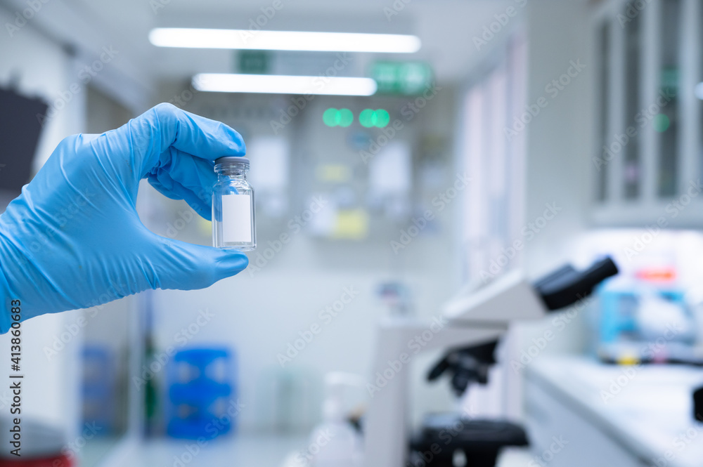 Fototapeta premium Scientists are preparing a vaccine to be placed in sterile boosters for use in patients infected with the pandemic virus.