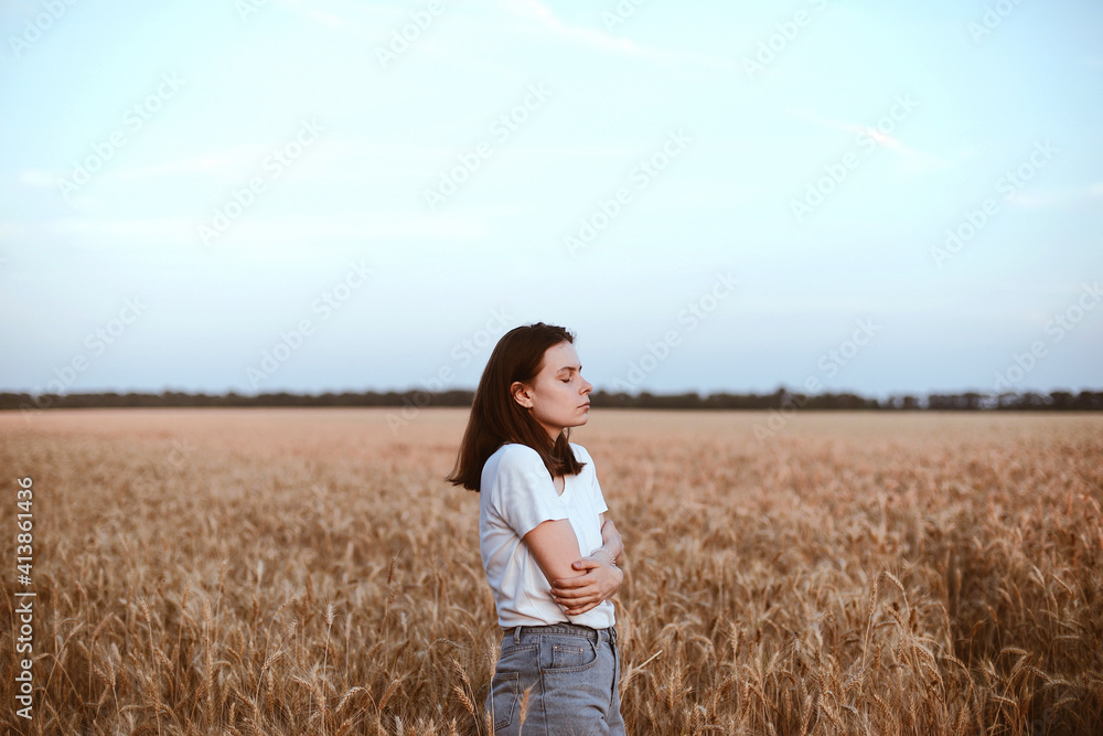 Portrait of young woman standing on wheat field against sky Portrait of young woman standing on wheat field against sky