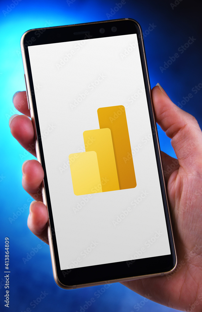 Hand holding smartphone displaying logo of Power BI Stock Photo | Adobe ...
