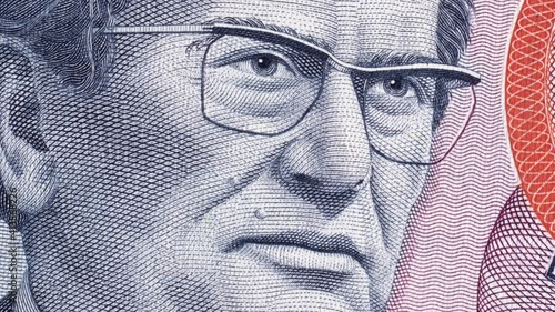 Josip Broz Tito on vintage Yugoslavia dinar banknote rotating. Leader of Yugoslav communist revolutionary, President of Yugoslavia