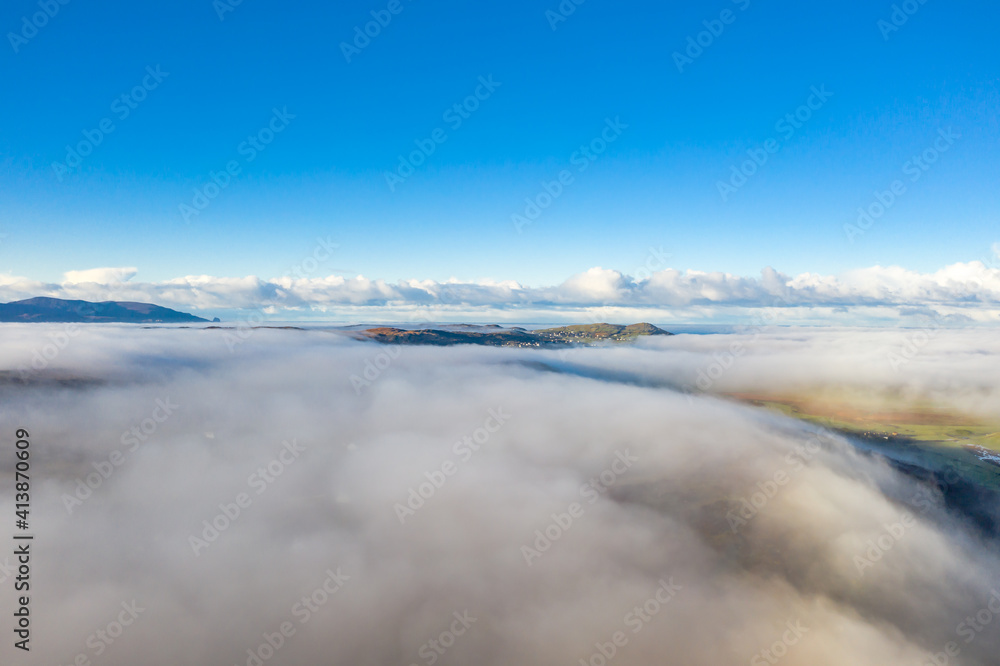 Above the clouds at Portnoo in County Donegal with fog - Ireland