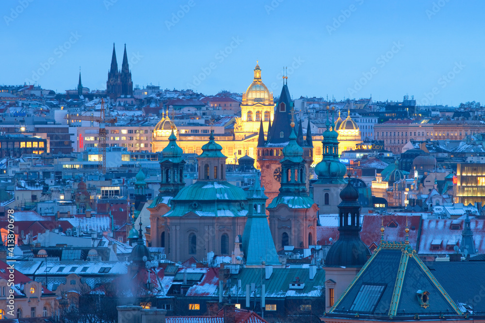Prague - Spires of the Old town and illuminated National museum.