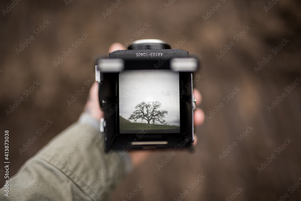 Top down photo looking through view finder of TLR film camera Top down photo looking through view finder of TLR film camera