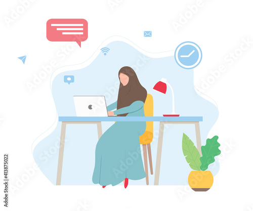 Muslim woman with hijab working on a laptop