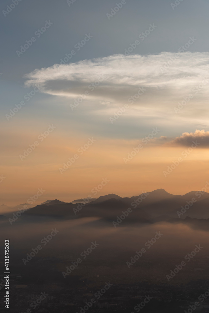 Beautiful nature view to mountains with orange sunset clouds Beautiful nature view to mountains with orange sunset clouds