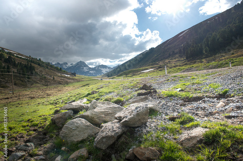 Pile of rocks at roadside in rugged alpine landscape