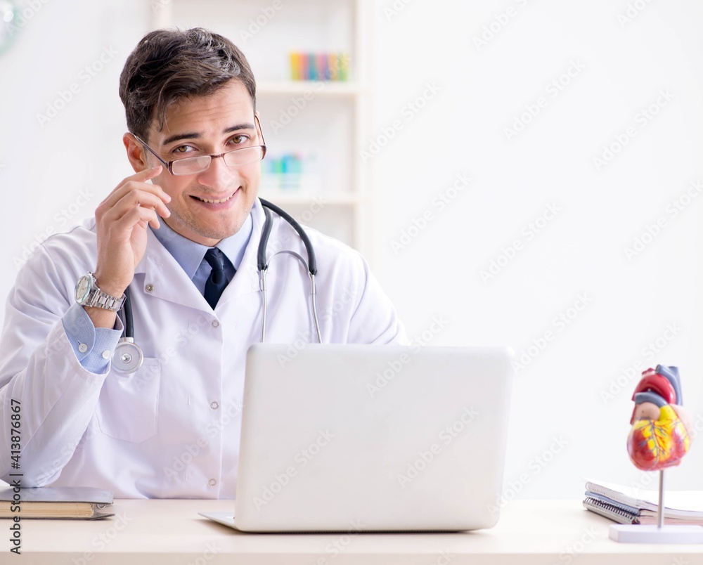 Doctor lecturer explaining the heart model Doctor lecturer explaining the heart model