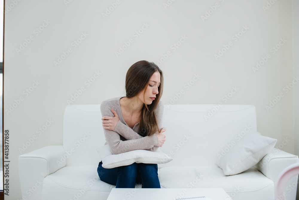 A young girl during depression communicates with a psychologist in the office. Psychological help. A young girl during depression communicates with a psychologist in the office. Psychological help.
