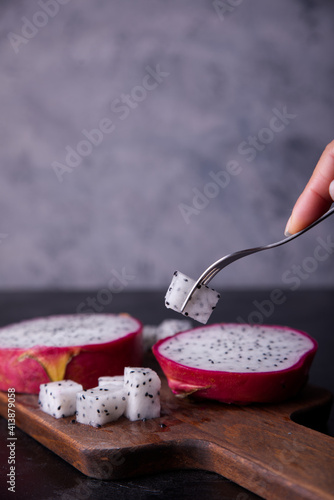 Exotic dragon fruits exposed on gray background