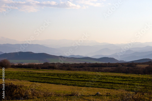 Mountain range landscape during sunset, view of mountain and peak lines, horizon © taidundua