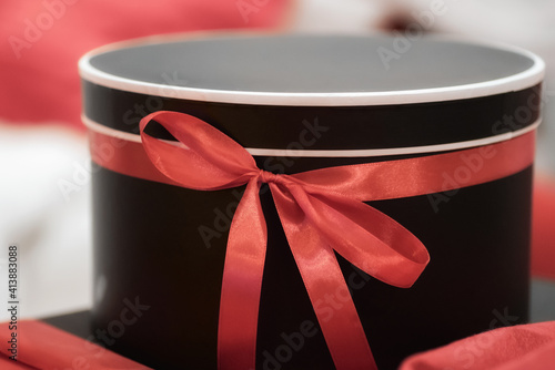 gift surprise box with red ribbon