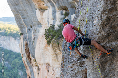 Climber removing the rope in Buoux, France