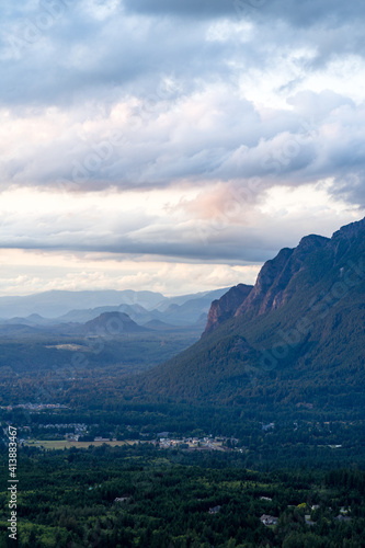 Cloudy summer sunset at Mt Si, Washington with small town at the base photo