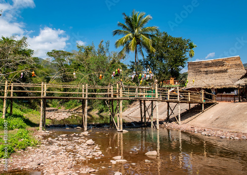 Bamboo bridge at the village of Bo Kluea which means Salt well photo