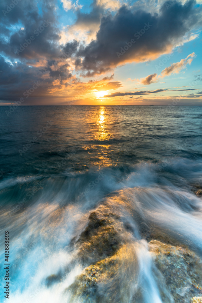 Tropical sunset over waves of Caribbean sea, Antilles Tropical sunset over waves of Caribbean sea, Antilles