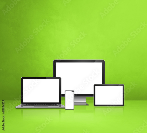 computer  laptop  mobile phone and digital tablet pc. green background