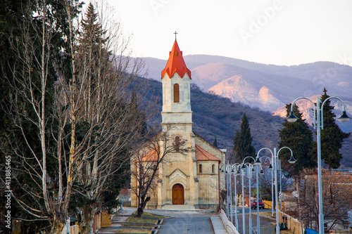 Church in Asureti, Georgia. Old famous church facade and street. photo