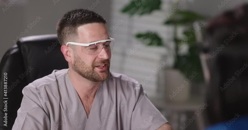 Doctors are having a team meeting at their office. Medical staff talking with each other during the break, giving advice about patients 4k footage Doctors are having a team meeting at their office. Medical staff talking with each other during the break, giving advice about patients 4k footage