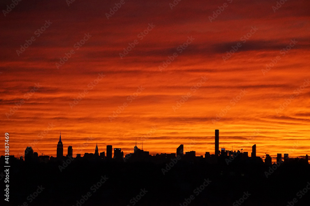 Silhouette buildings against orange sky Silhouette buildings against orange sky
