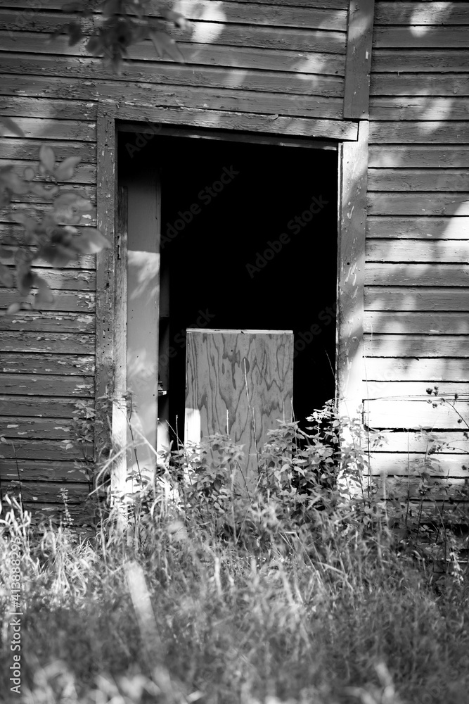 Open closet door in wooden barn wall Open closet door in wooden barn wall