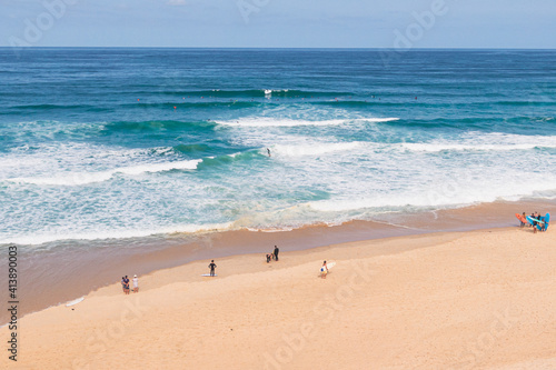 Photography drone shot of the beach with surfers, seignosse, landes, france