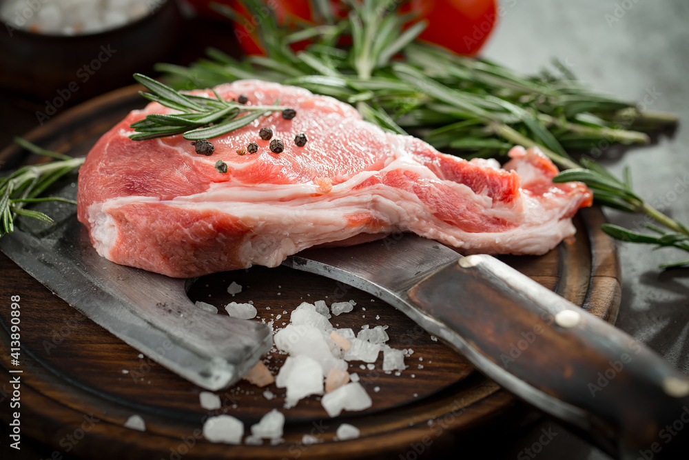 Raw meat with spices in a composition with kitchen accessories. Raw meat with spices in a composition with kitchen accessories.