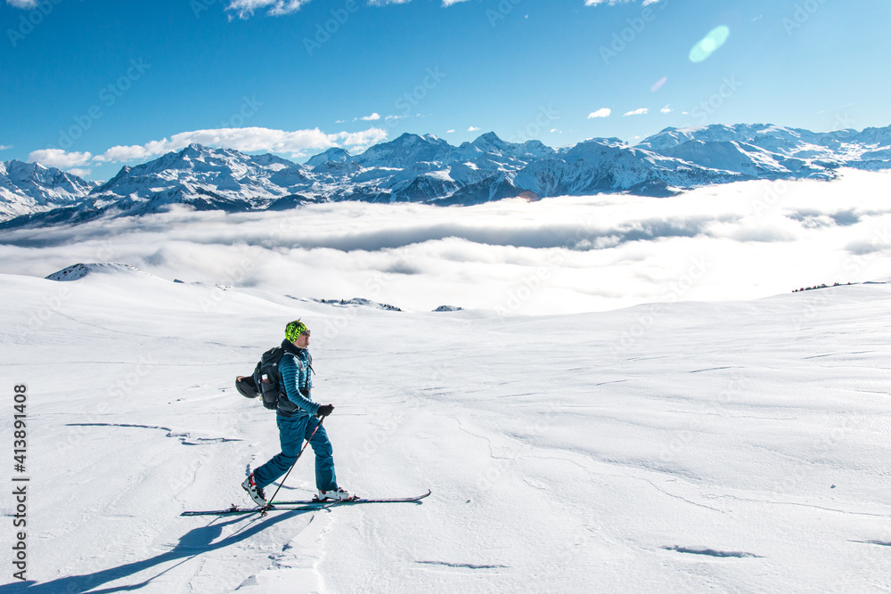 Ski touring over sea of clouds, Beaufortain, French Alps, France
