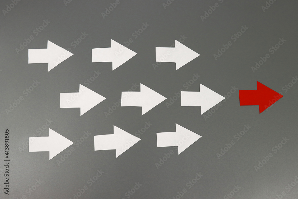 Fototapeta premium Leadership concept. Red leader arrow leading team forward