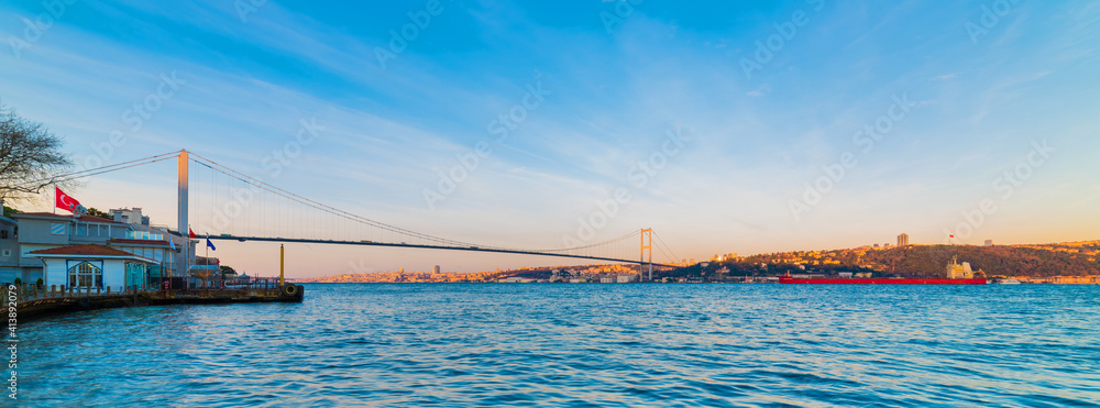ISTANBUL, TURKEY. Panoramic view of Istanbul Bosphorus on sunset. Beautiful cloudy blue sky.