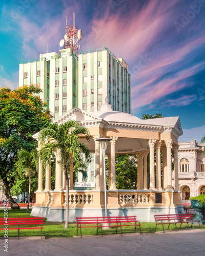 Gazebo and Hotel in the Leoncio Vidal Park which is a National Monument, Santa Clara, Cuba photo