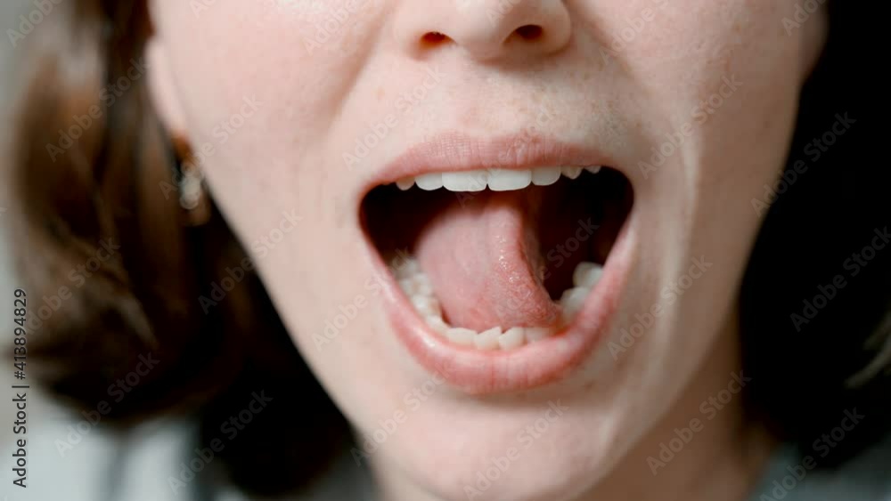 Articulatory gymnastics for the tongue. Close-up speech therapist shows language exercises. Articulatory gymnastics for the tongue. Close-up speech therapist shows language exercises.