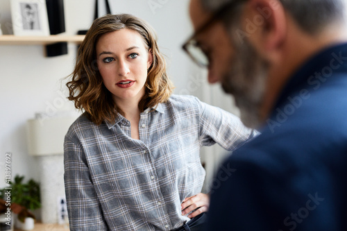 Wallpaper Mural Businessman discussing with female colleague in creative office Torontodigital.ca