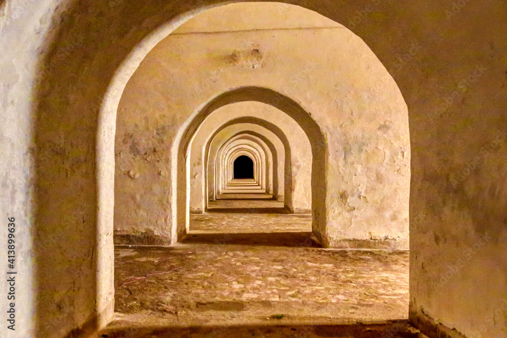 Arched walkway under a sea side walled fortress in Sale, Morocco