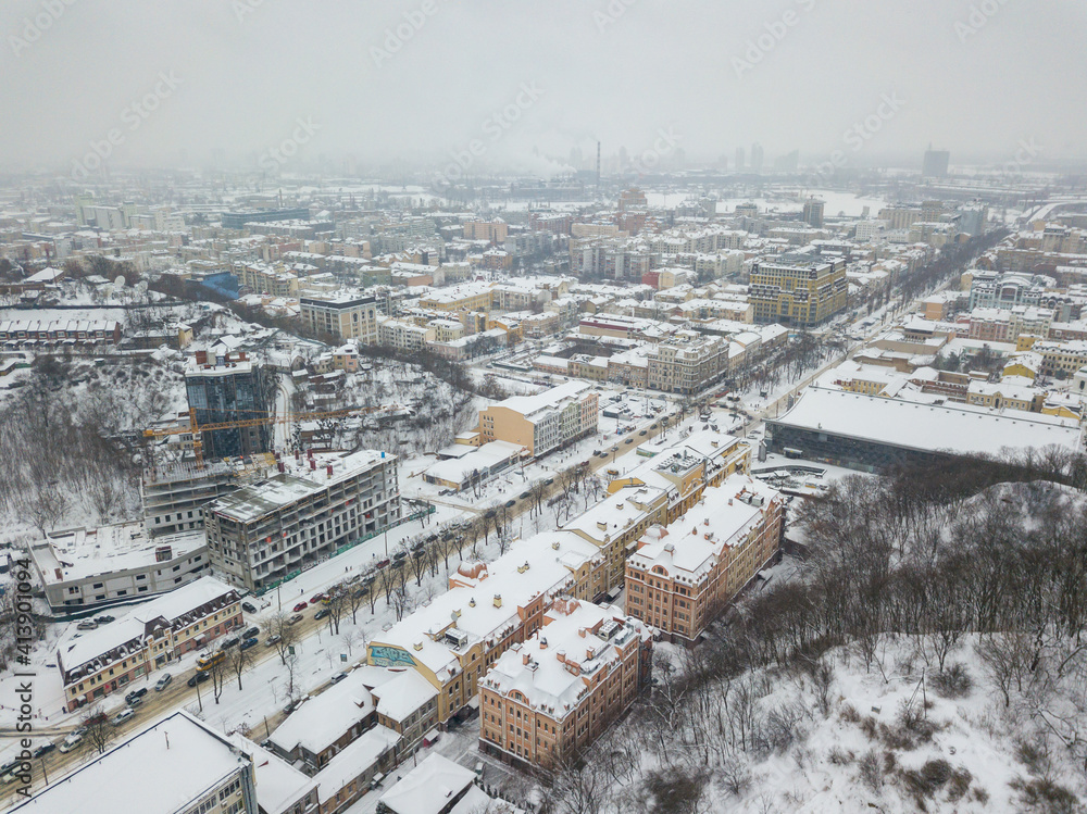 Snow-covered building. Aerial drone view. Winter snowy morning.