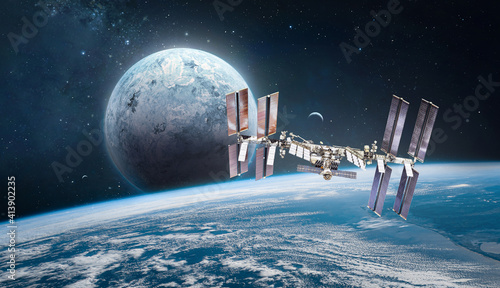 Fototapeta Naklejka Na Ścianę i Meble -  International space station on orbit of the Earth planet. View from outer space. Solar system. Spaceship with planets. Elements of this image furnished by NASA
