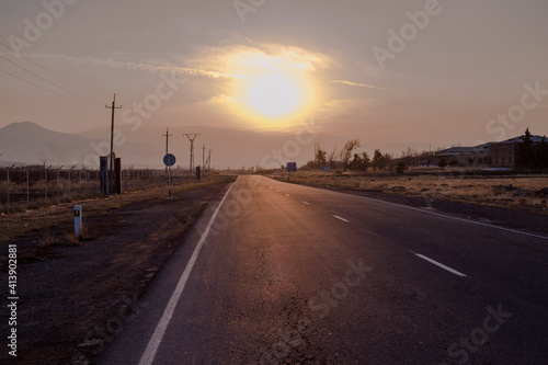 Scenic landscape scene and sunrise over the road