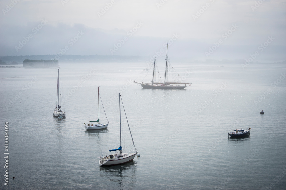 Boats moored on a foggy morning in Portland, Maine Boats moored on a foggy morning in Portland, Maine