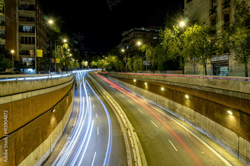 time lapse lights and streets in the city of Barcelona at night photo