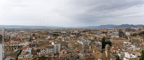 panorama view of the rooftops and city of Granada in Andalusia