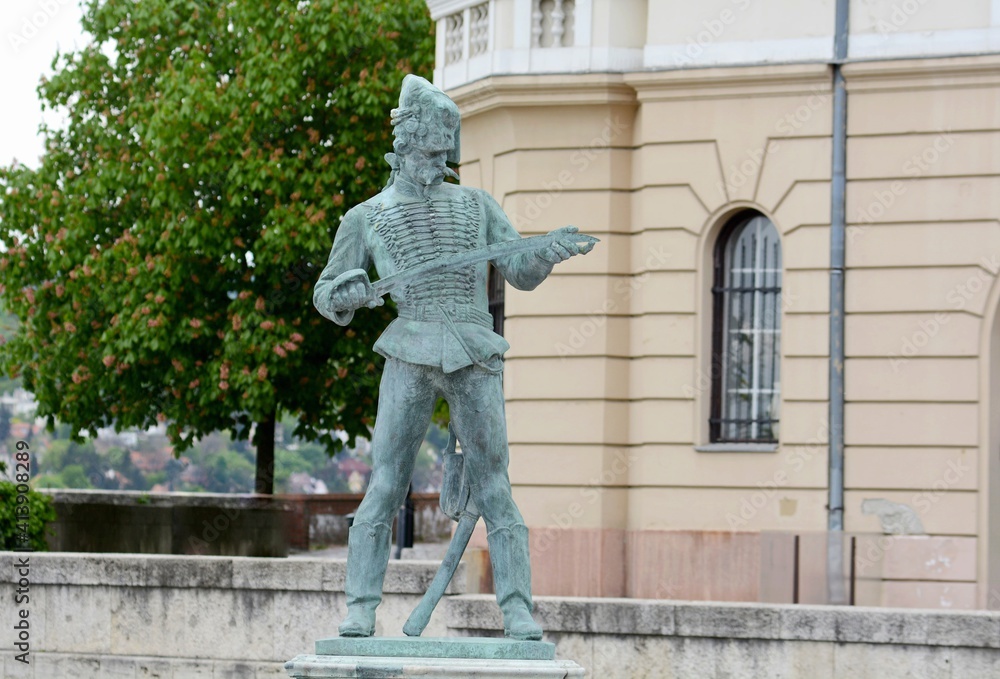 Naklejka premium A statue of a Hungarian hussar in the uniform of the time of Empress Maria Theresa. Buda fortress. Budapest. Hungary