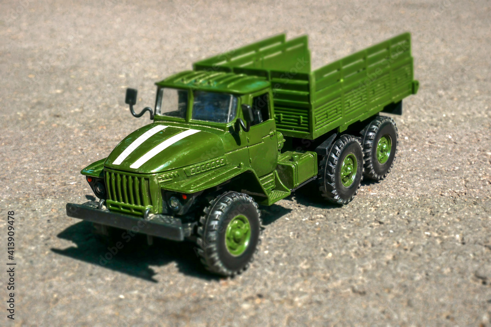 Toy military vehicle on the road Toy military vehicle on the road
