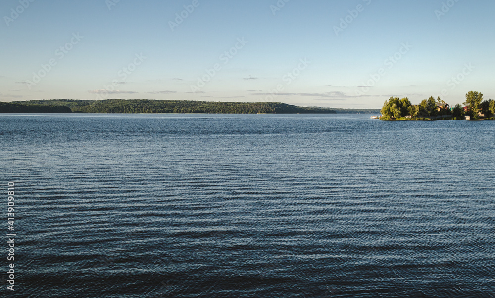 Lake landscape with ripples on water, relaxing view