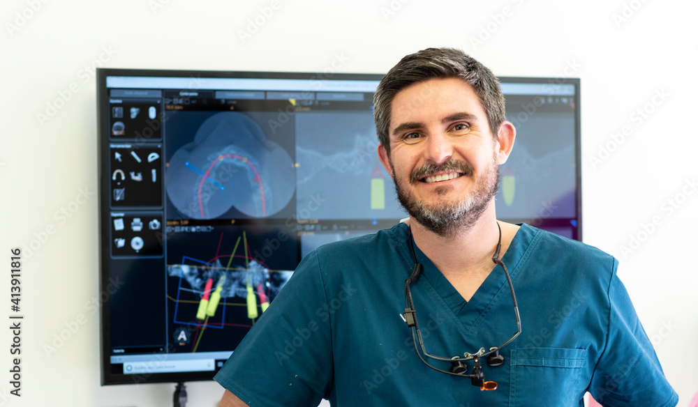 Portrarit of dentist with screen on background in dental clinic. Portrarit of dentist with screen on background in dental clinic.