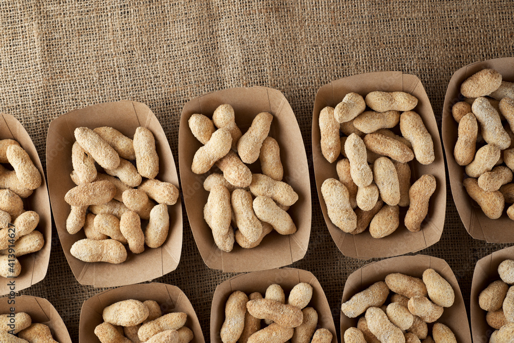 Peanuts with shell in disposable cardboard boxes. Peanuts with shell in disposable cardboard boxes.