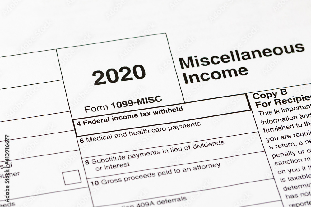 1099 miscellaneous income tax form. Concept of income taxes and federal tax information.